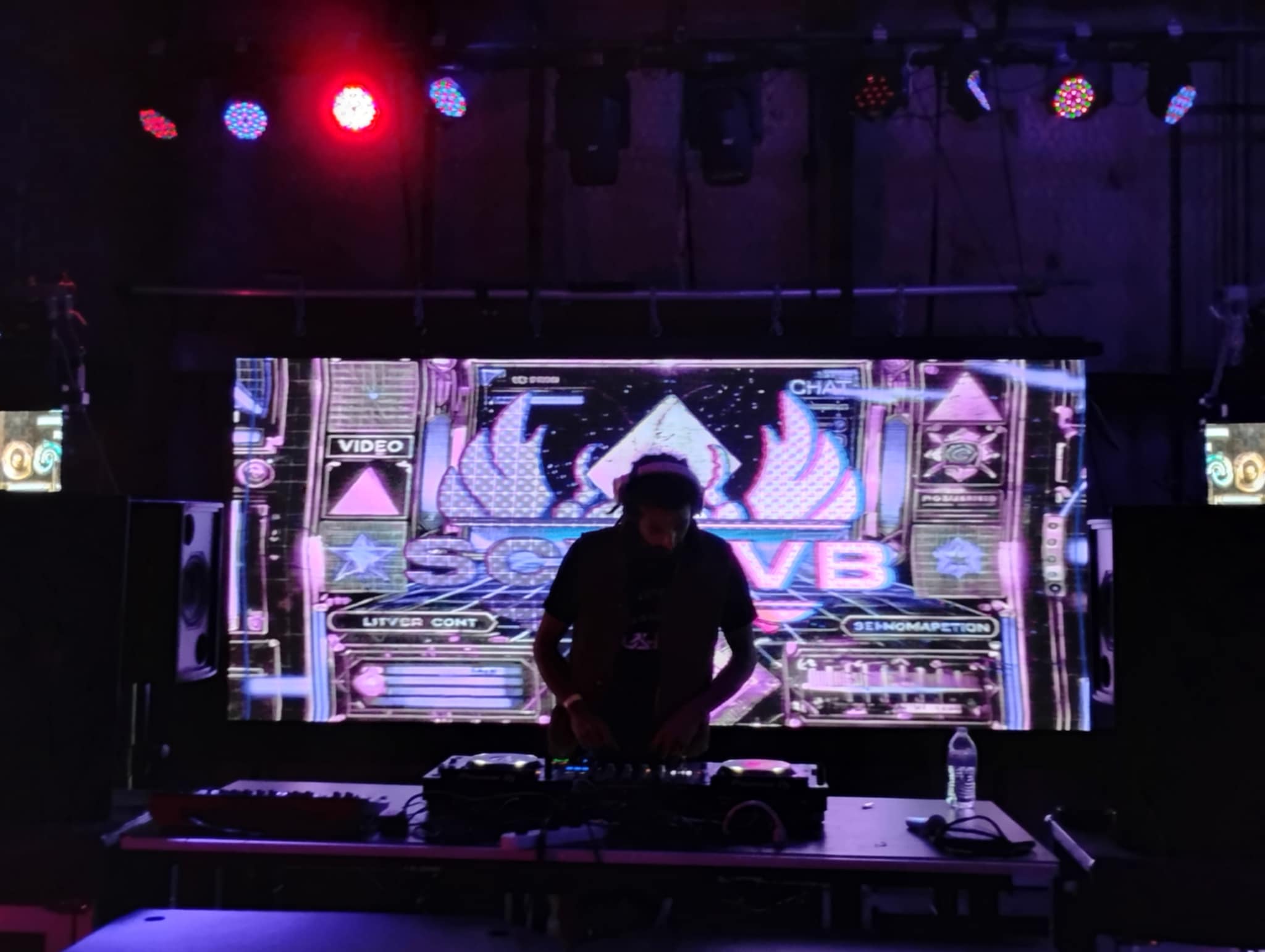 SCVRVB performing live ritual with matrix-style visuals