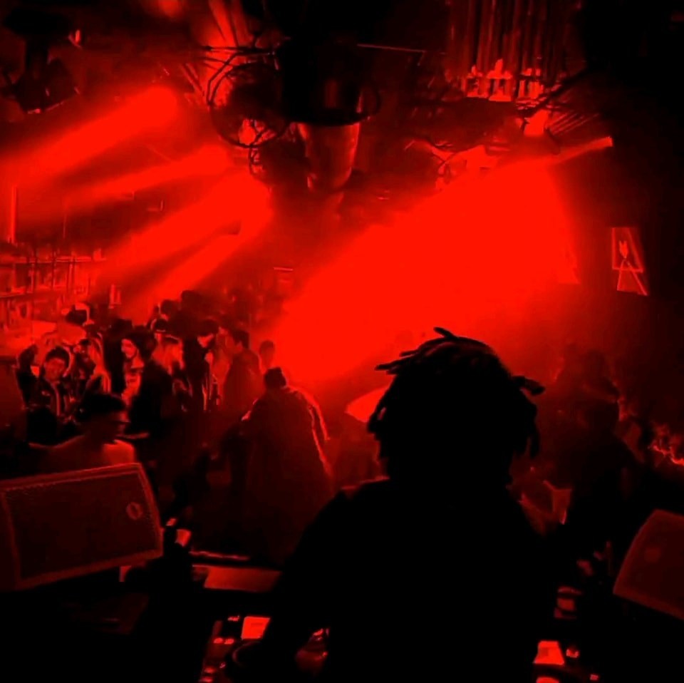 SCVRVB live set with intense red stage lighting and crowd energy